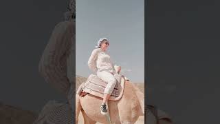 A woman riding  a camel 🐪 #love #shortvideo #camelrides