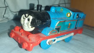 photos of broken and well loved childhood thomas toys with slow music