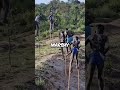 African tribes people using stilts to traverse