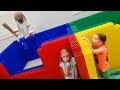 Teaching Granny to Babysit Our Baby Brother! Hide and Seek in Giant Lego Fort!