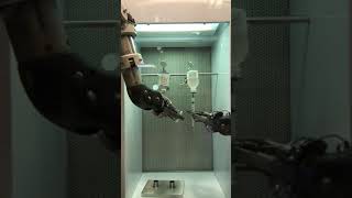 Dispensing FDG drug using a robotic arm.