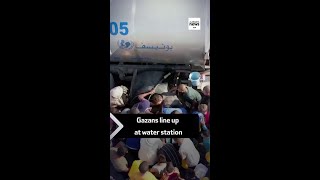 Gazans line up at water station