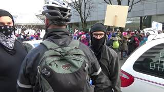 ANTIFA scumbag Luis Marquez trolling bicyclist at Trump impeachment rally