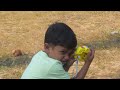 aadhavan and varnika plays near tree with mom and dad