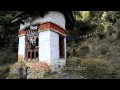 traditional water powered prayer wheel in bhutan with tsa tsa cones