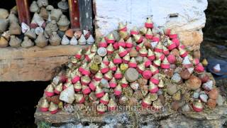 Traditional water-powered prayer wheel in Bhutan with Tsa Tsa cones