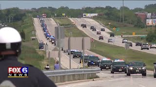 Hundreds salute Officer John Hetland during funeral, procession