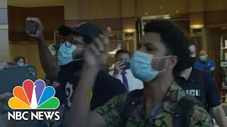 'Shame On You Ron DeSantis!': Protesters Interrupt Florida Governor's Briefing | NBC News NOW