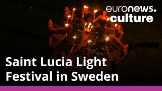Lights dazzle in swimming pool to celebrate festive Santa Lucia Day in Sweden