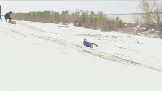 LSU students enjoy snow on top of frozen Mississippi River Levee