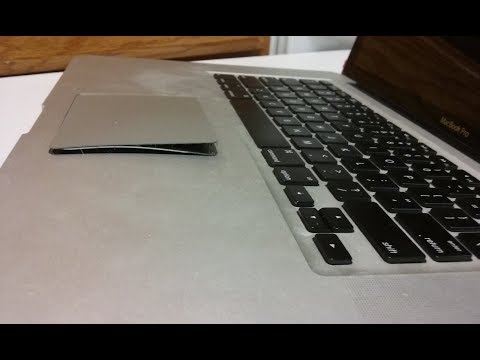Trackpad pushed up on an Apple Macbook Pro Trackpad pushed up on an Apple Macbook Pro
