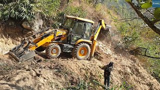 Narrow New Mountain Road on a Rocky Hill with JCB Backhoe