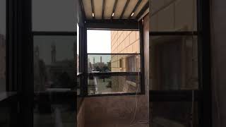 AL Wazzan guillotine vertical motorized glass