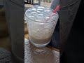 girl making bubbles with milk