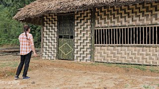 beautiful girl. finishing the door for the bamboo house