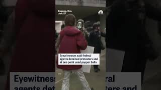 Federal officers clash with anti-ICE protesters outside a federal building in Eugene, Oregon