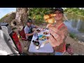 truck camping under a remote bridge in the woods fishing cooking camping