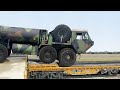 Loading Massive US Armored Trucks on Train during Heavy Rail Operation