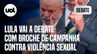 Lula vai a debate com broche de campanha contra violência sexual infantil
