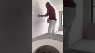 Hand taping drywall flats and butt joints.