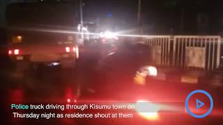 Police truck driving through Kisumu town on Thursday night as residence shout at them