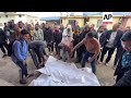 prayers at gaza hospital for mother father and child killed in israeli airstrike