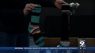 Burch’s Shoes collects 500 pairs of socks to assist families in need