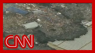 Watch a massive tsunami engulf entire towns in Japan (2011)