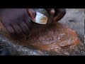ROYALTY FREE AFRICAN STOCK VIDEO OF WOMAN GRINDING PEPPER.